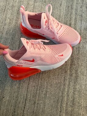 Nike Pink Sneakers with Red Heel Accent